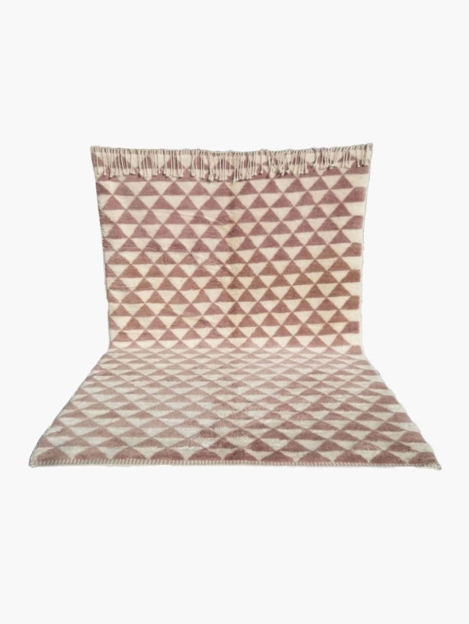 A rectangular wool rug with a geometric pattern in beige and brown tones.